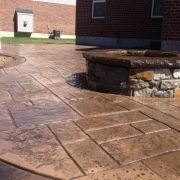 Real Stone Fire Pit Placed on a Stamped Concrete Patio in Loveland Ohio